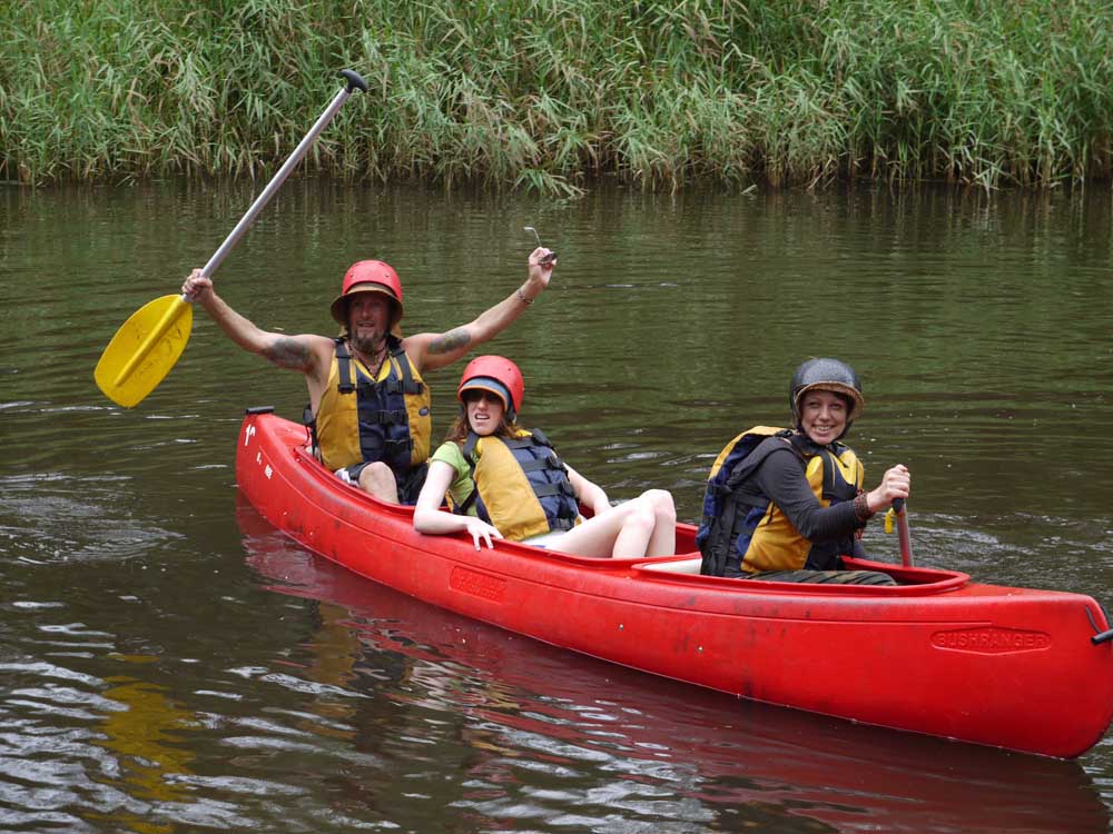 Kel and Alice with boatsman celebrating