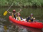 Kel and Alice with boatsman celebrating